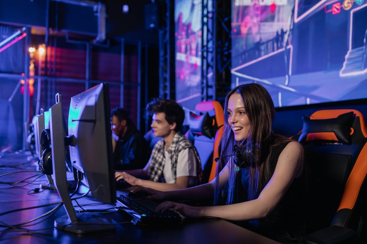 A group of young adults enjoying a gaming session in a vibrant esports arena.